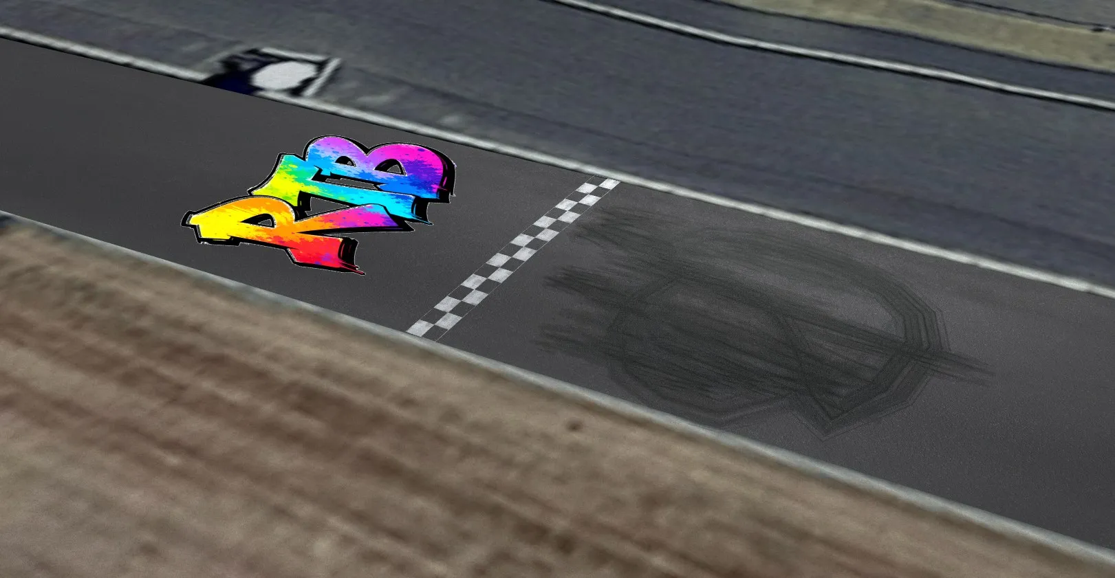 A painted RTB logo, a chequered line and burnout marks laid as decals on the same stretch of track