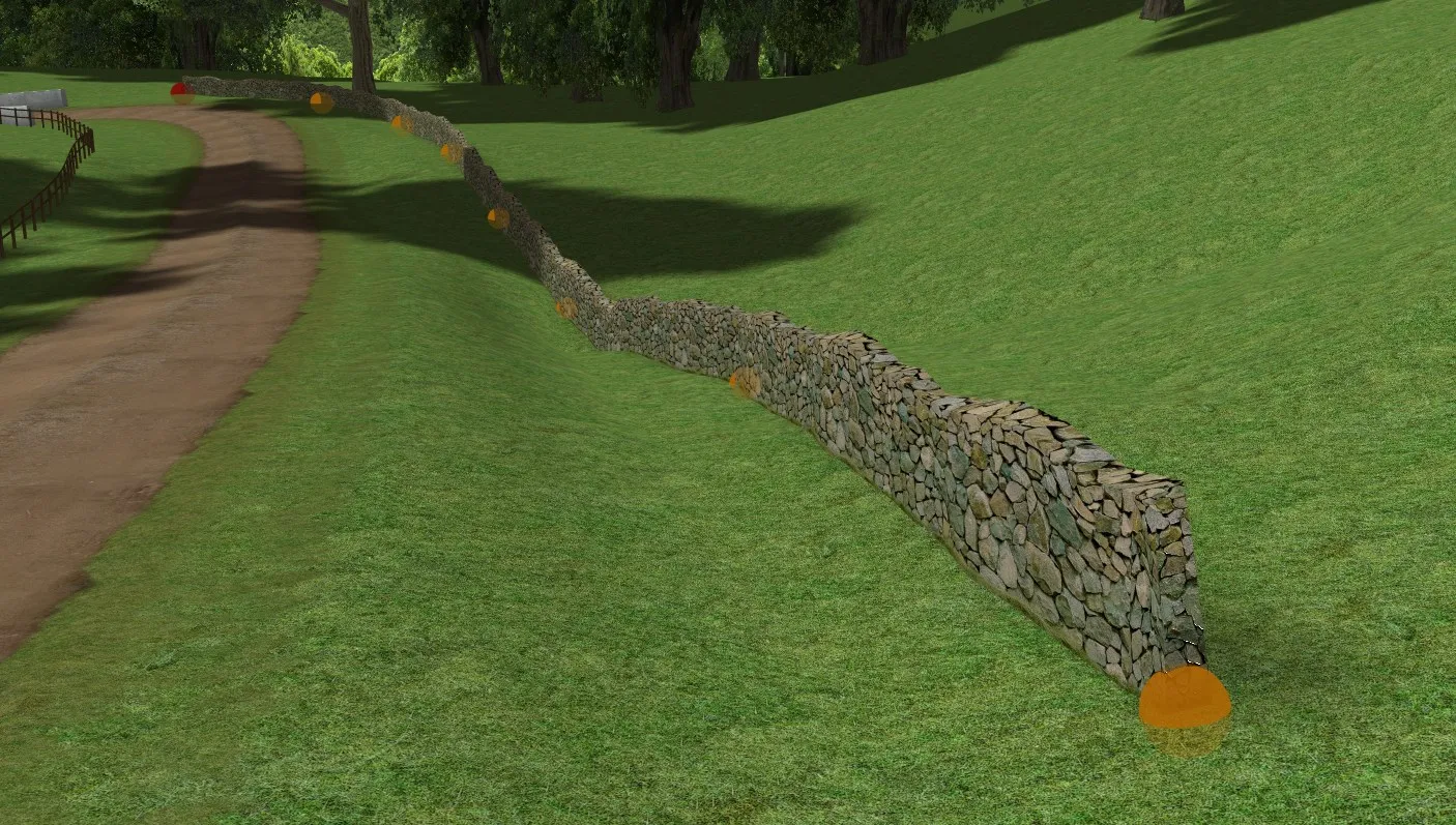 A dry stone wall string object running over rolling hills beside a dirt road